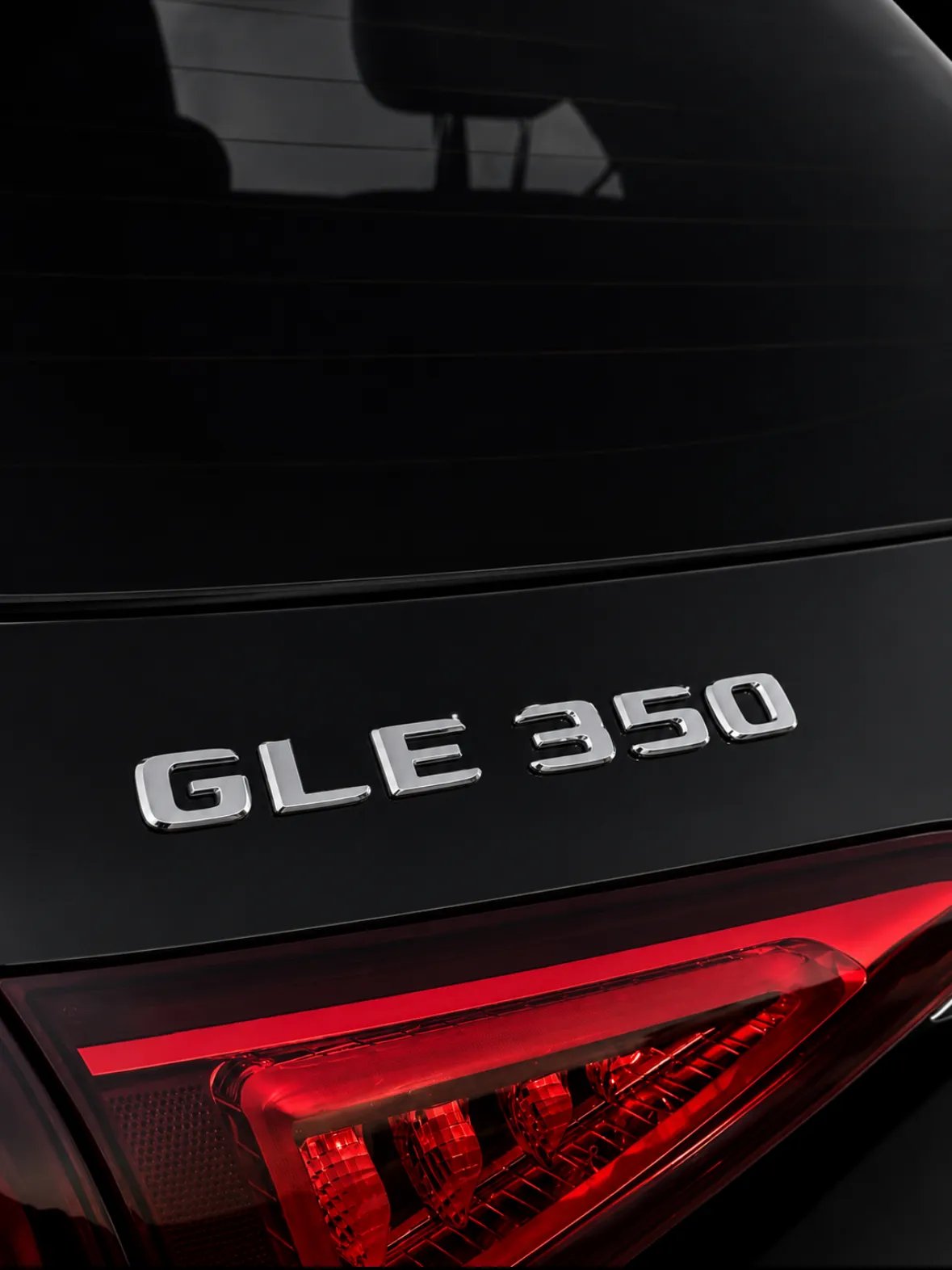 Chrome GLE 350 badge on gloss black paint after a full detail